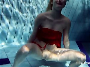 steaming blonde Lucie French nubile in the pool